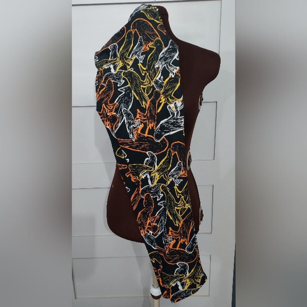 LuLaRoe Black Leggings with Orange, Yellow & White Bird Print